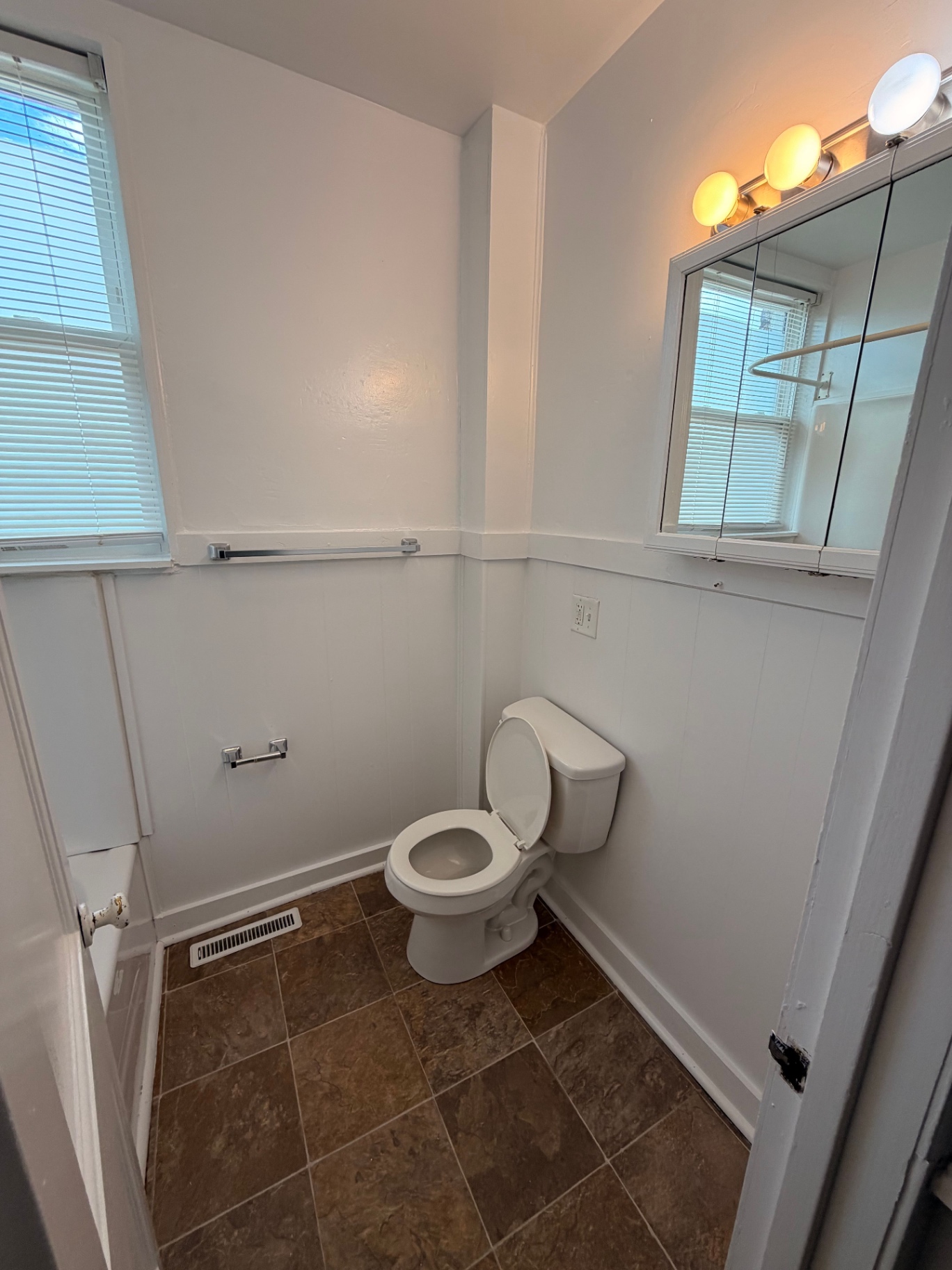 3340 Chestnut Upstairs second bathroom with wainscoting and window