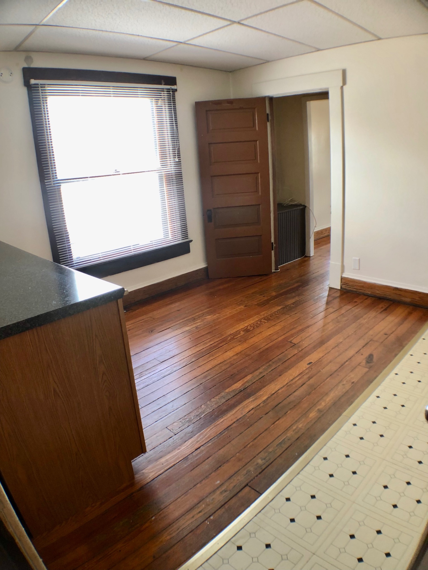 89 E Woodruff Ave. Unit A kitchen entry with hardwood floors transitioning to tile