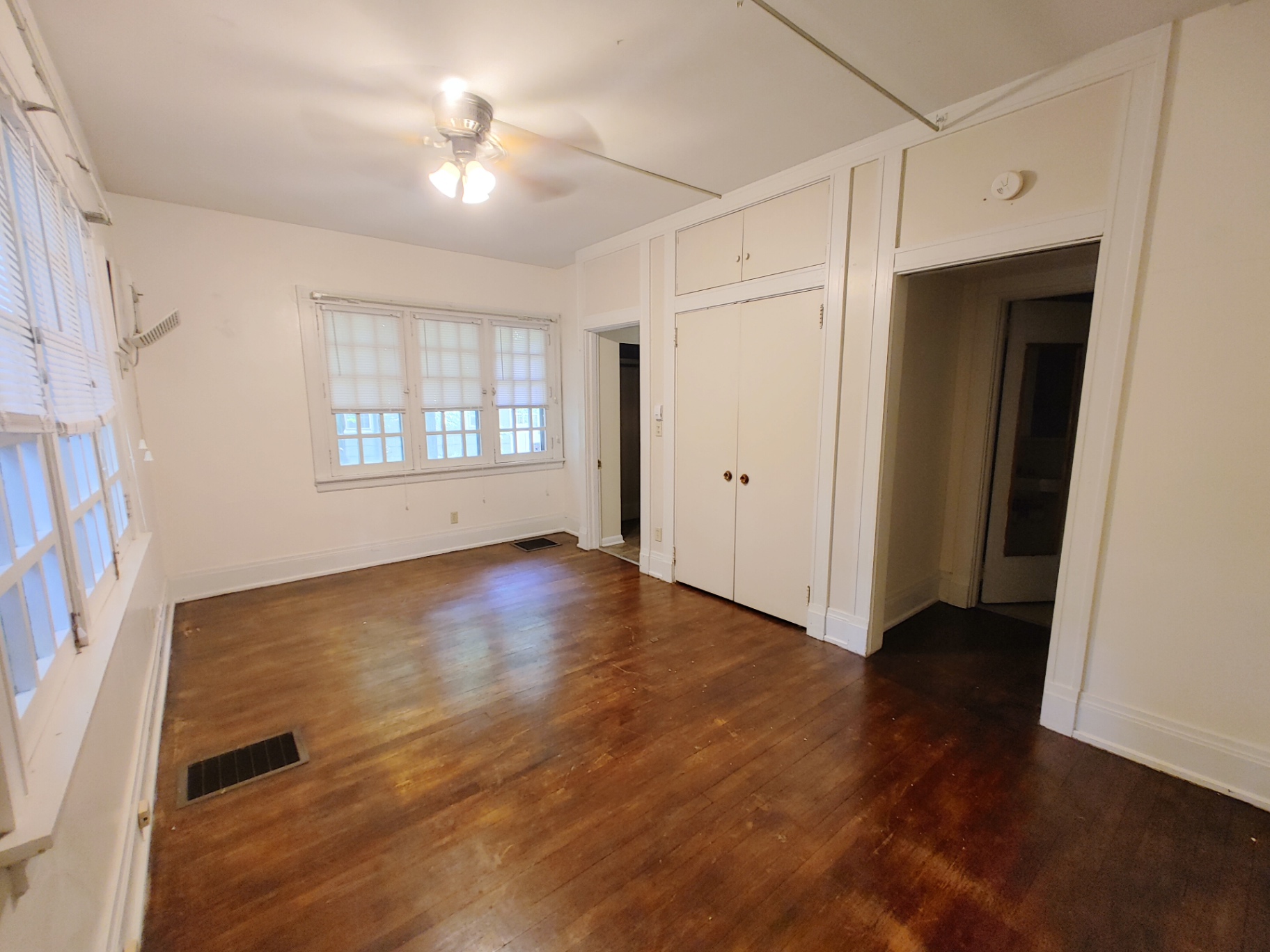 2026 Iuka Ave B sleeping/living area with hardwood floors and built-in closets