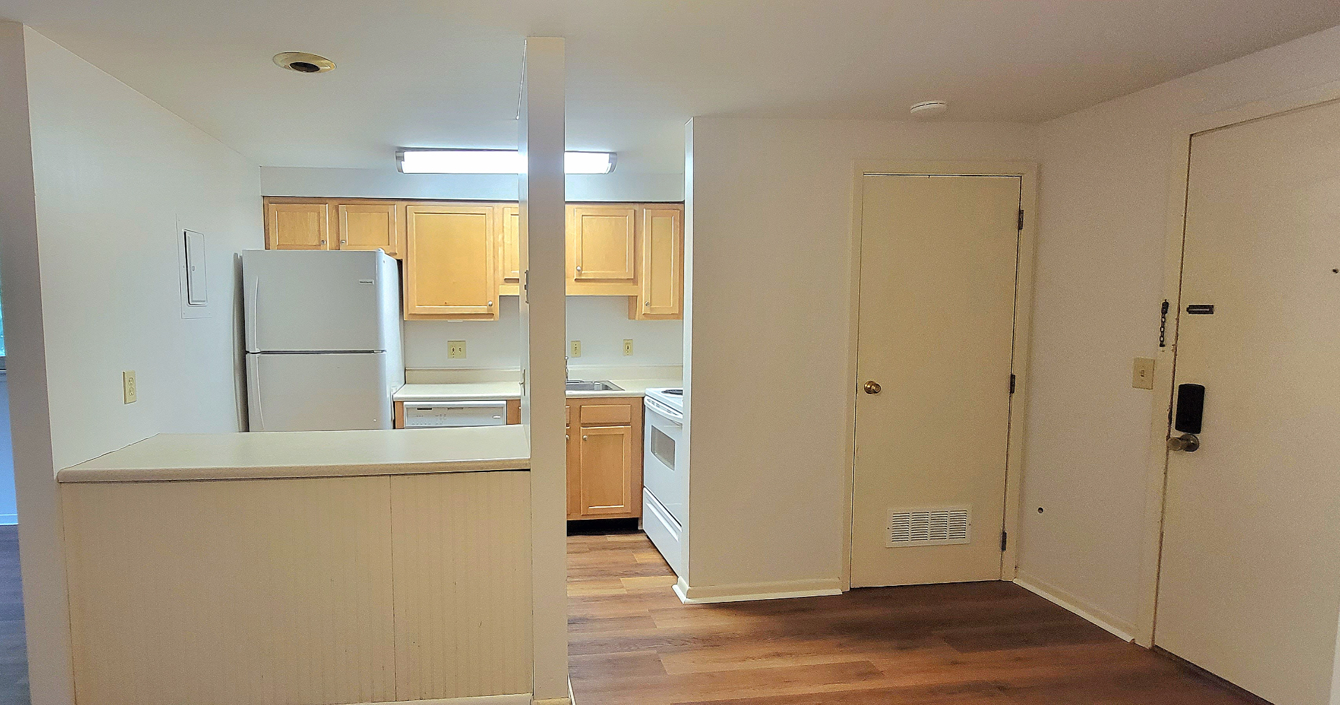 2024 Summit St. kitchen with maple cabinets, white appliances, and dishwasher