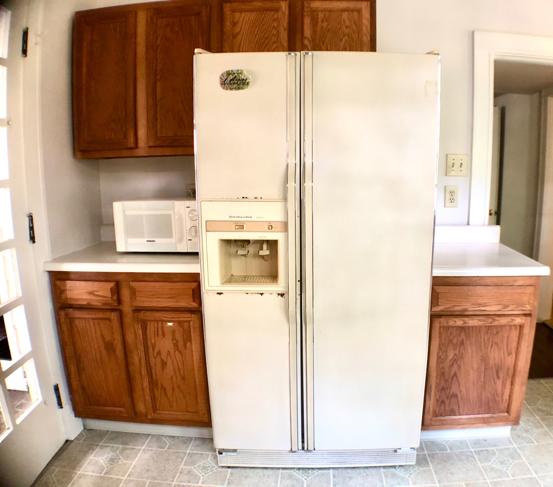 2026 Iuka Ave A kitchen with side-by-side refrigerator, oak cabinets, and counter workspace