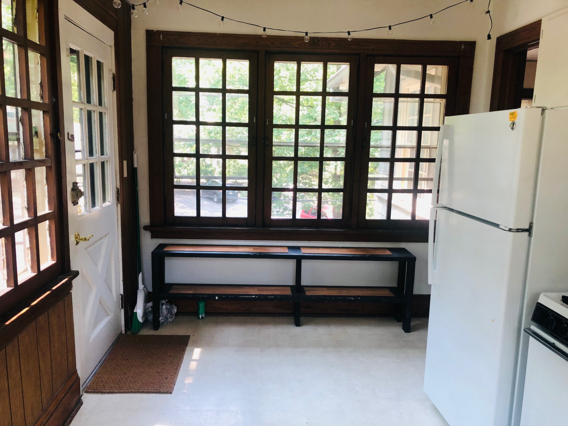 2026 Iuka Ave C eat-in kitchen with three walls of casement windows overlooking the ravine