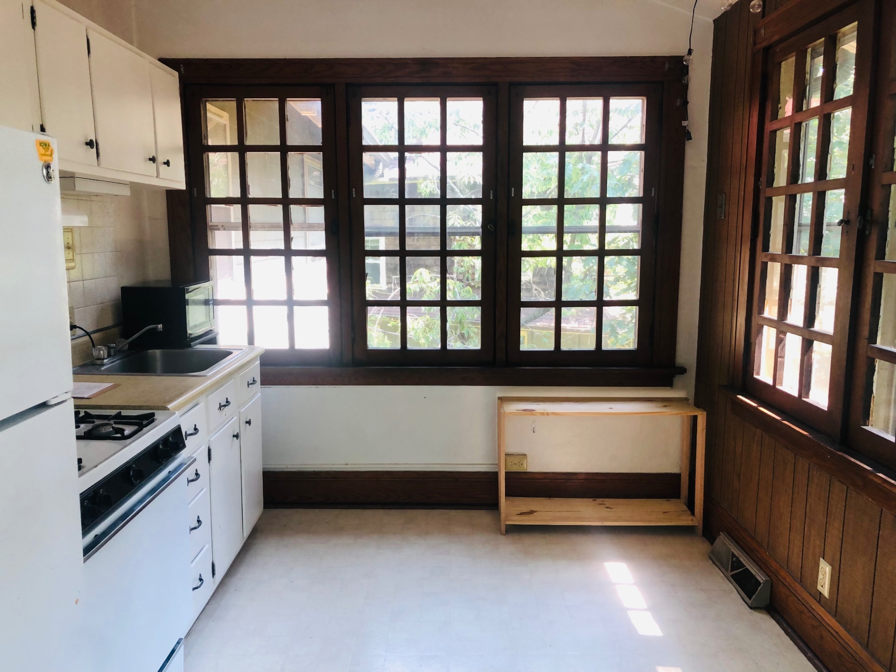 2026 Iuka Ave C kitchen with wide casement windows overlooking the ravine treetops