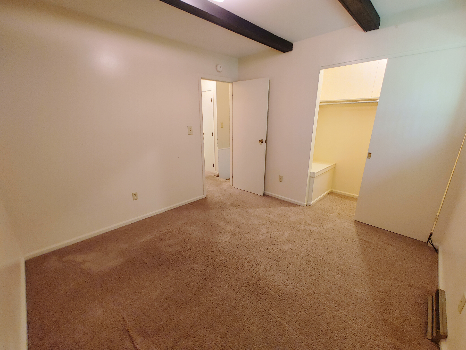 2020 Iuka Ave. bedroom view showing walk-in closet with built-in bench and shelving