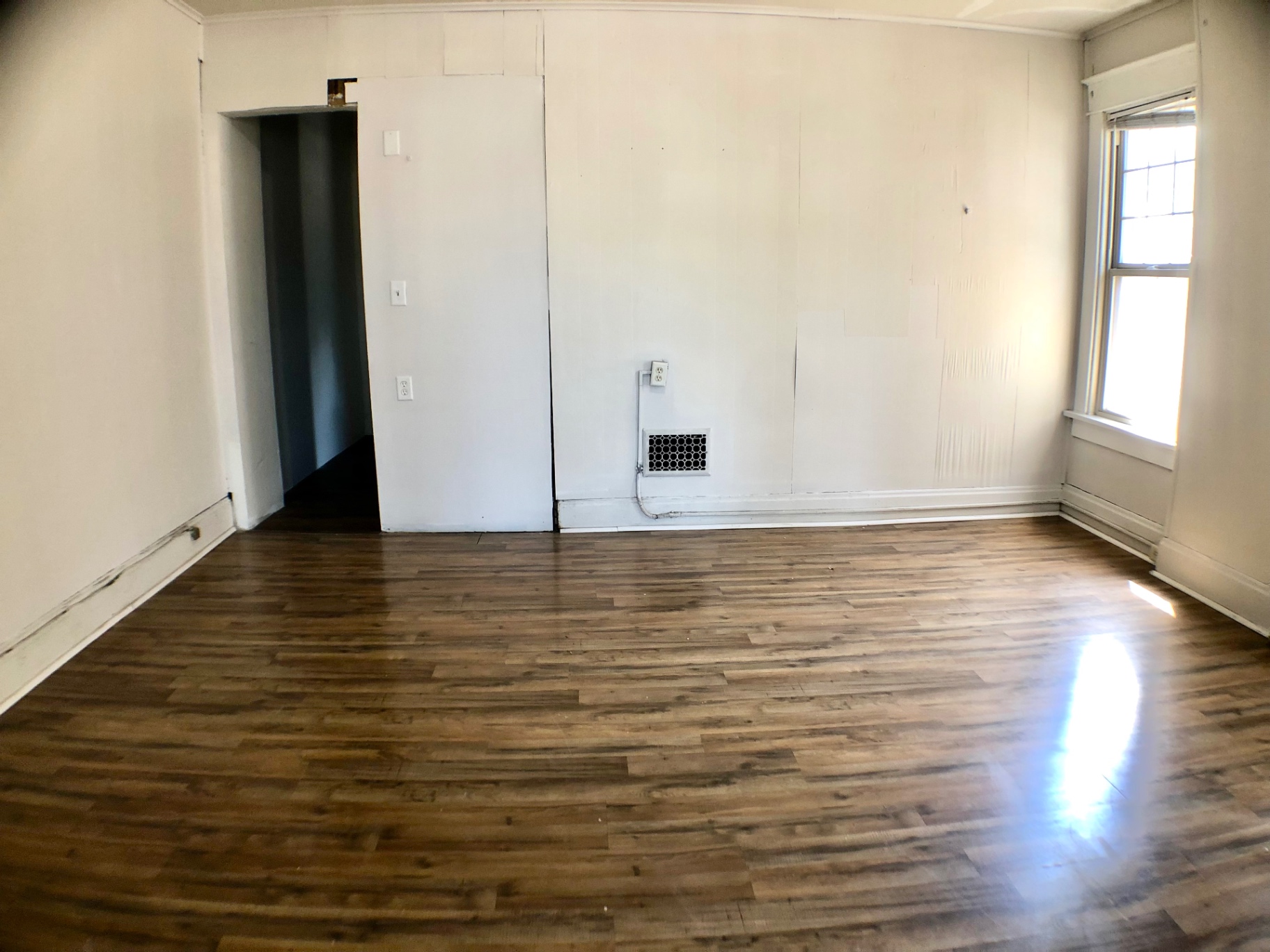 1814 Summit St. bedroom with hardwood floors, closet, and bright window