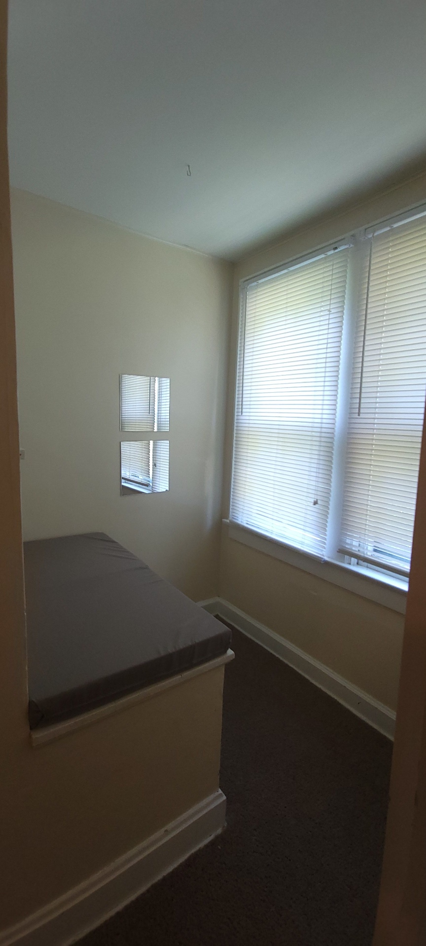 2054 Iuka Ave. C built-in window bench nook with large windows — cozy reading spot