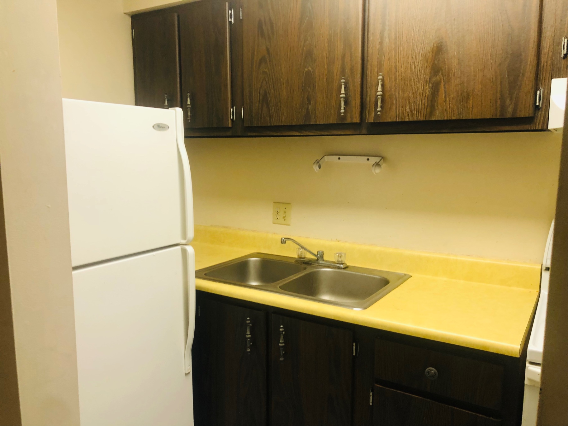 2028 Summit St. kitchen with double stainless sink and refrigerator