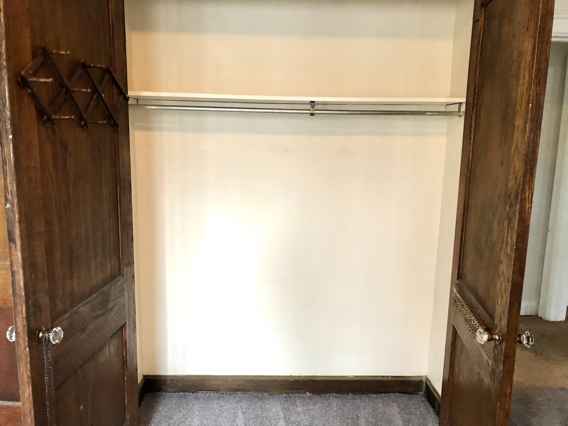 2044 Iuka Ave. B bedroom closet with dual French doors and original crystal knobs