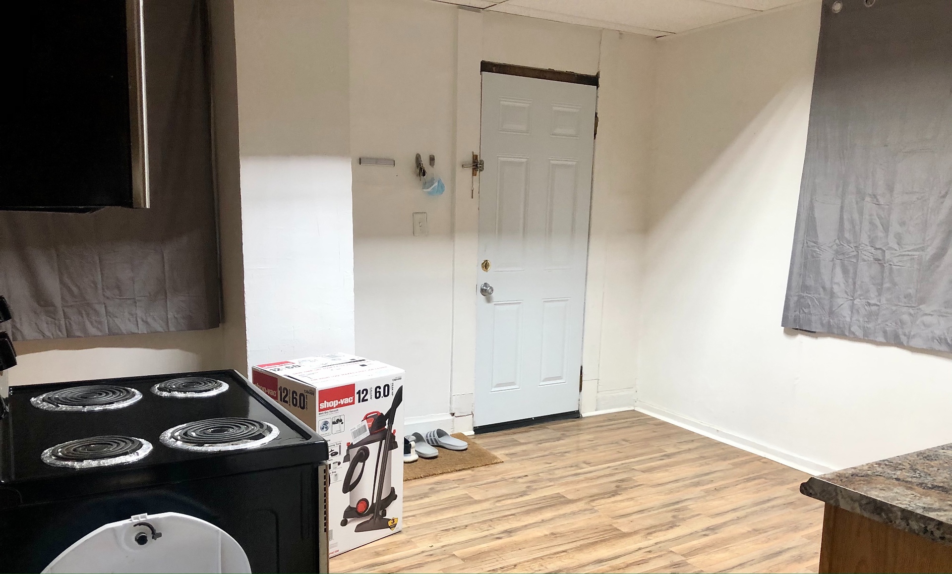 89 E Woodruff Ave. Unit 89 kitchen with back door to porch and plank flooring