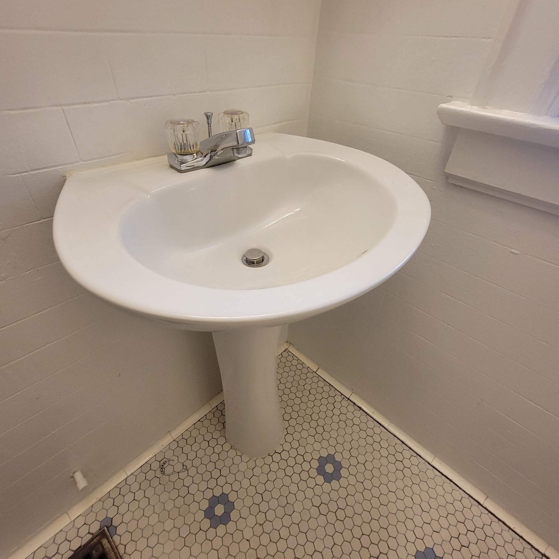 2048 Iuka Ave. C bathroom pedestal sink with vintage hex tile flooring
