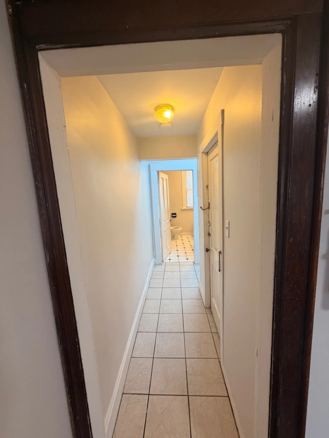 1816 Summit St. tiled hallway leading to the bathroom