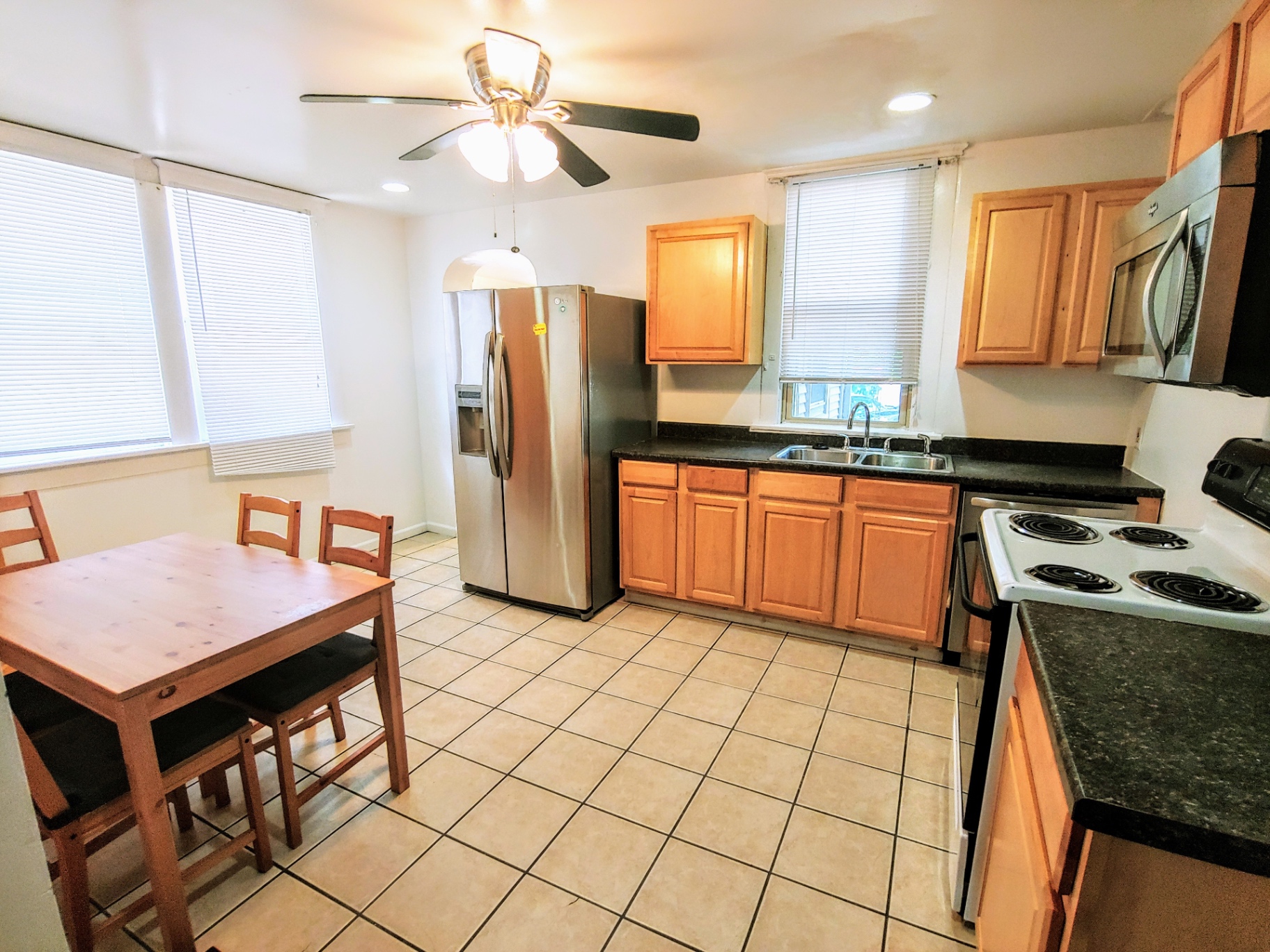 1818 Summit St. wide kitchen with maple cabinets, stainless appliances, and tile floor