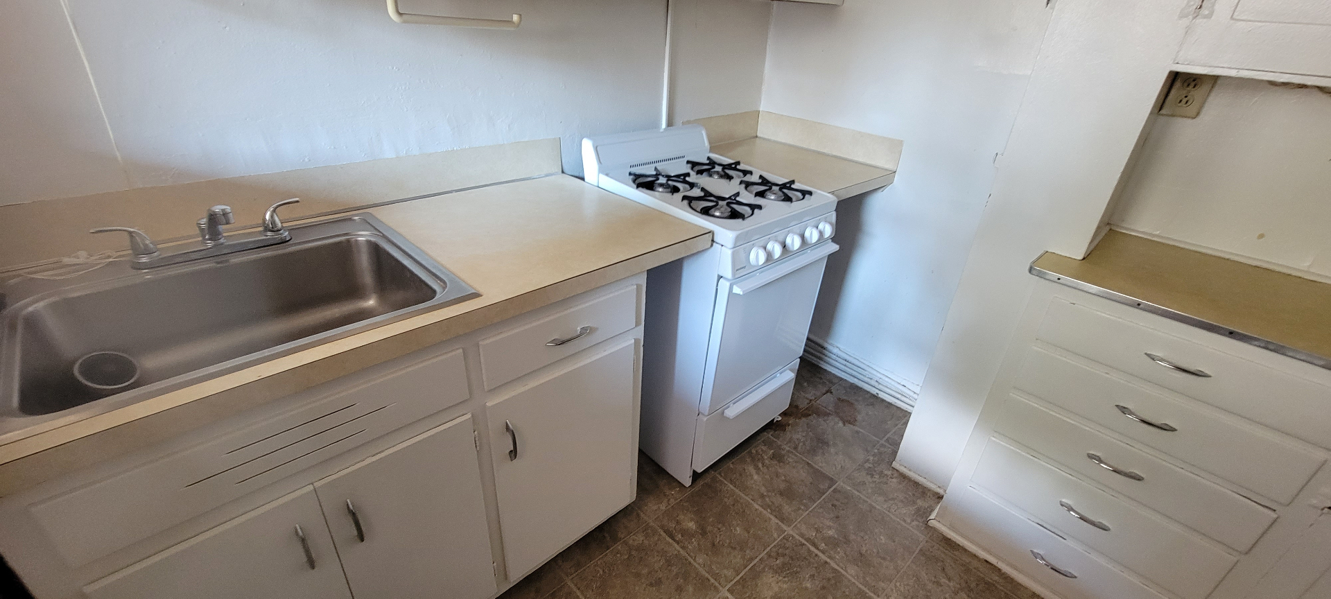 2044 Iuka Ave. D kitchen with deep stainless sink, gas range, and generous counter space
