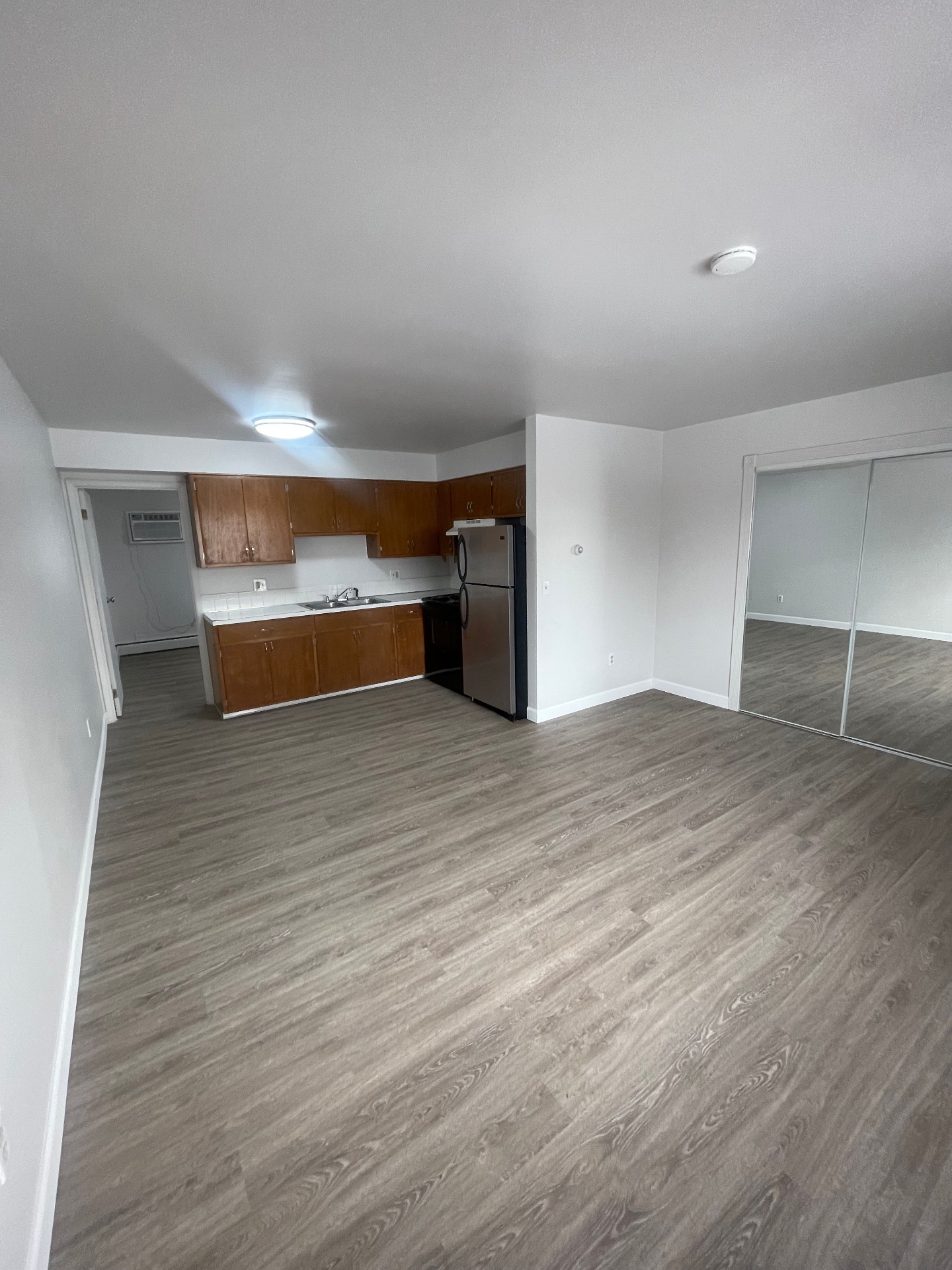 1827 N 4th St. Unit 8 spacious living area with adjacent kitchen and bedroom access