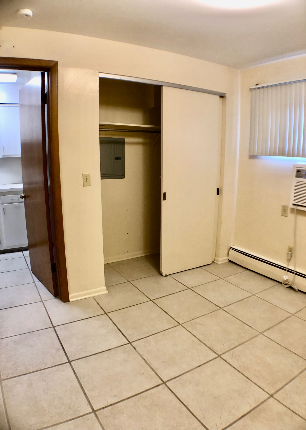 2040 Iuka Ave. 5A bedroom with large sliding closet and window AC unit