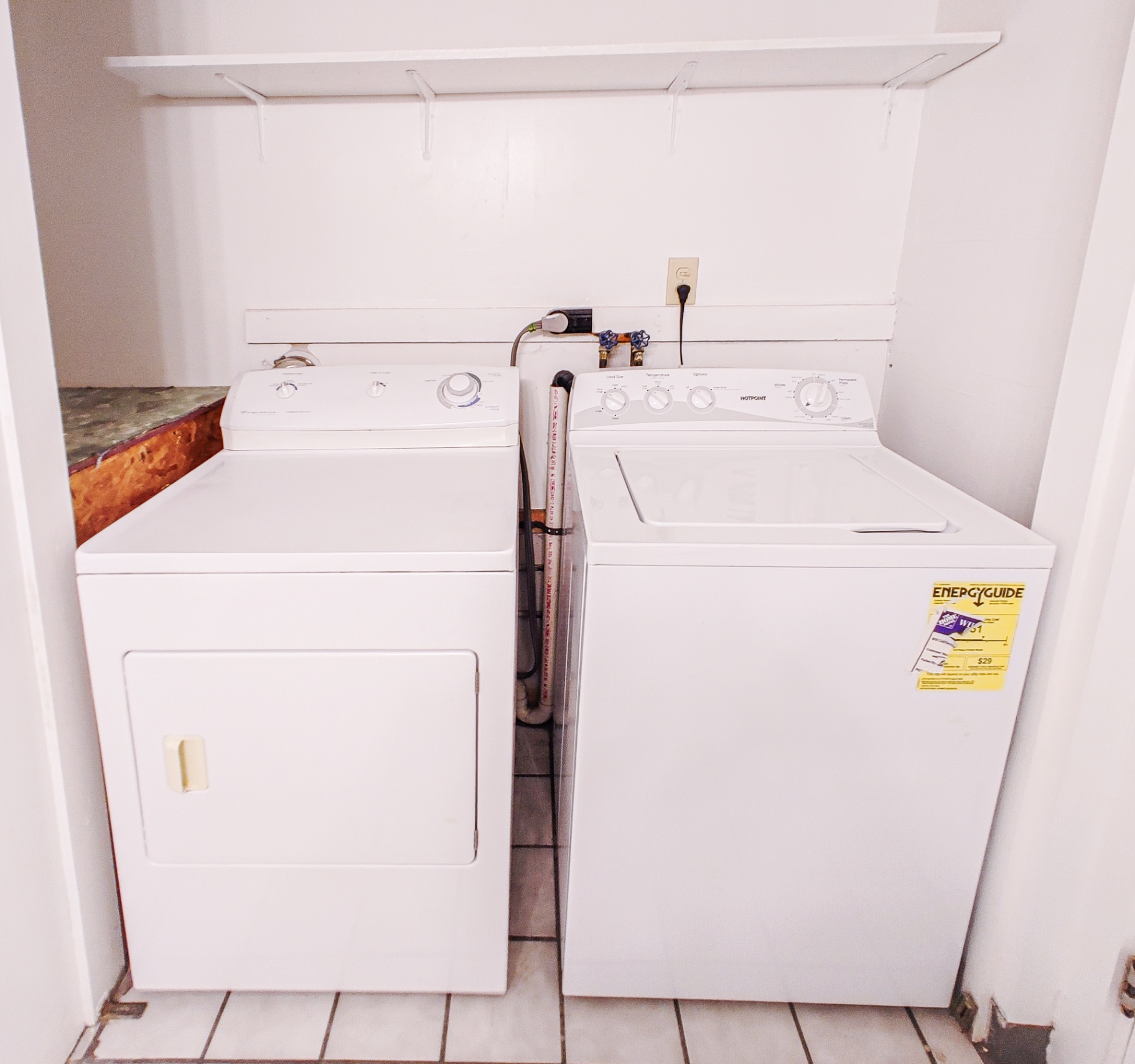 Rear unit in-unit laundry closet with washer and dryer