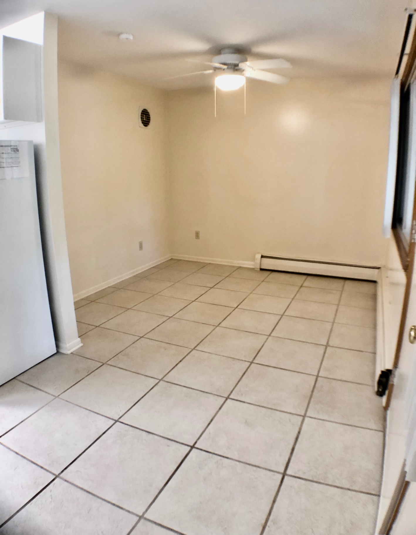 2040 Iuka Ave. 5A wide open living area with tile floors and baseboard heat