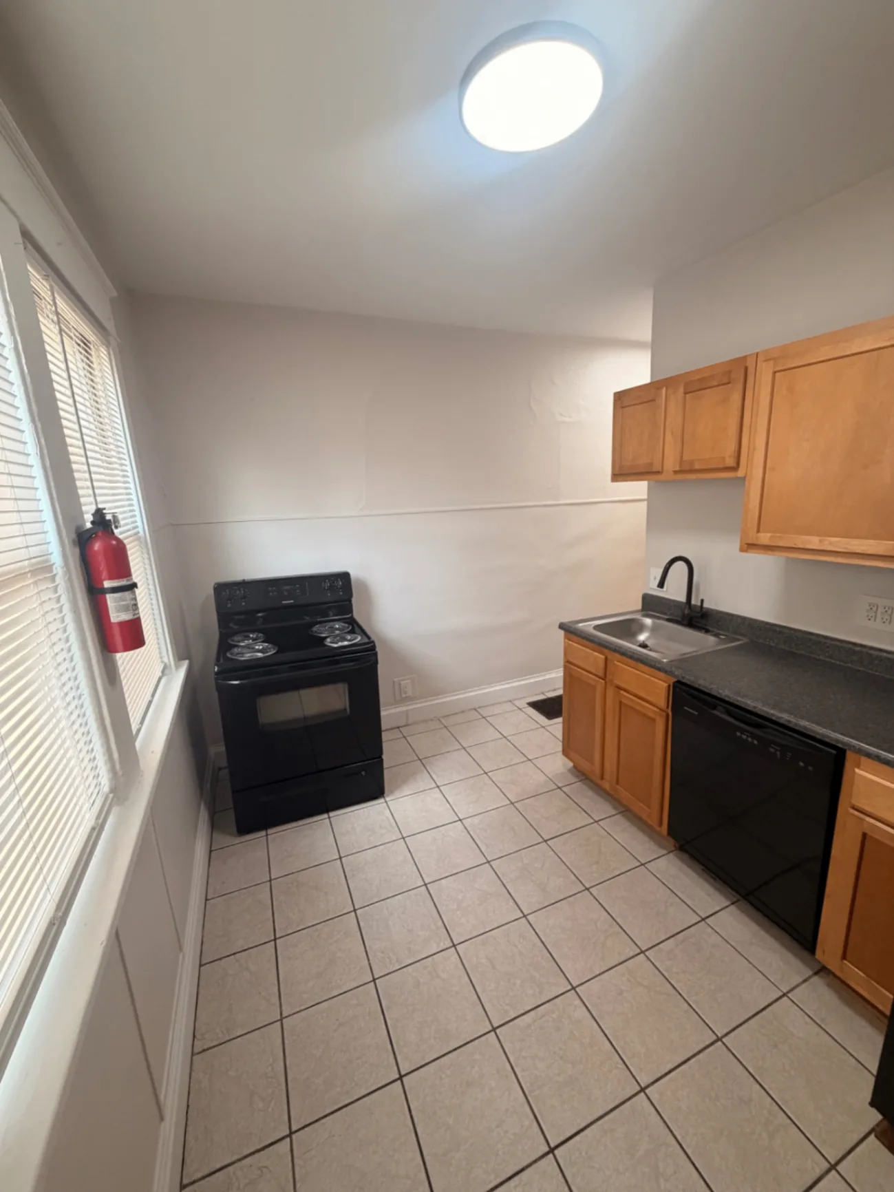 1816 Summit St. kitchen with electric range, dishwasher, and bright window