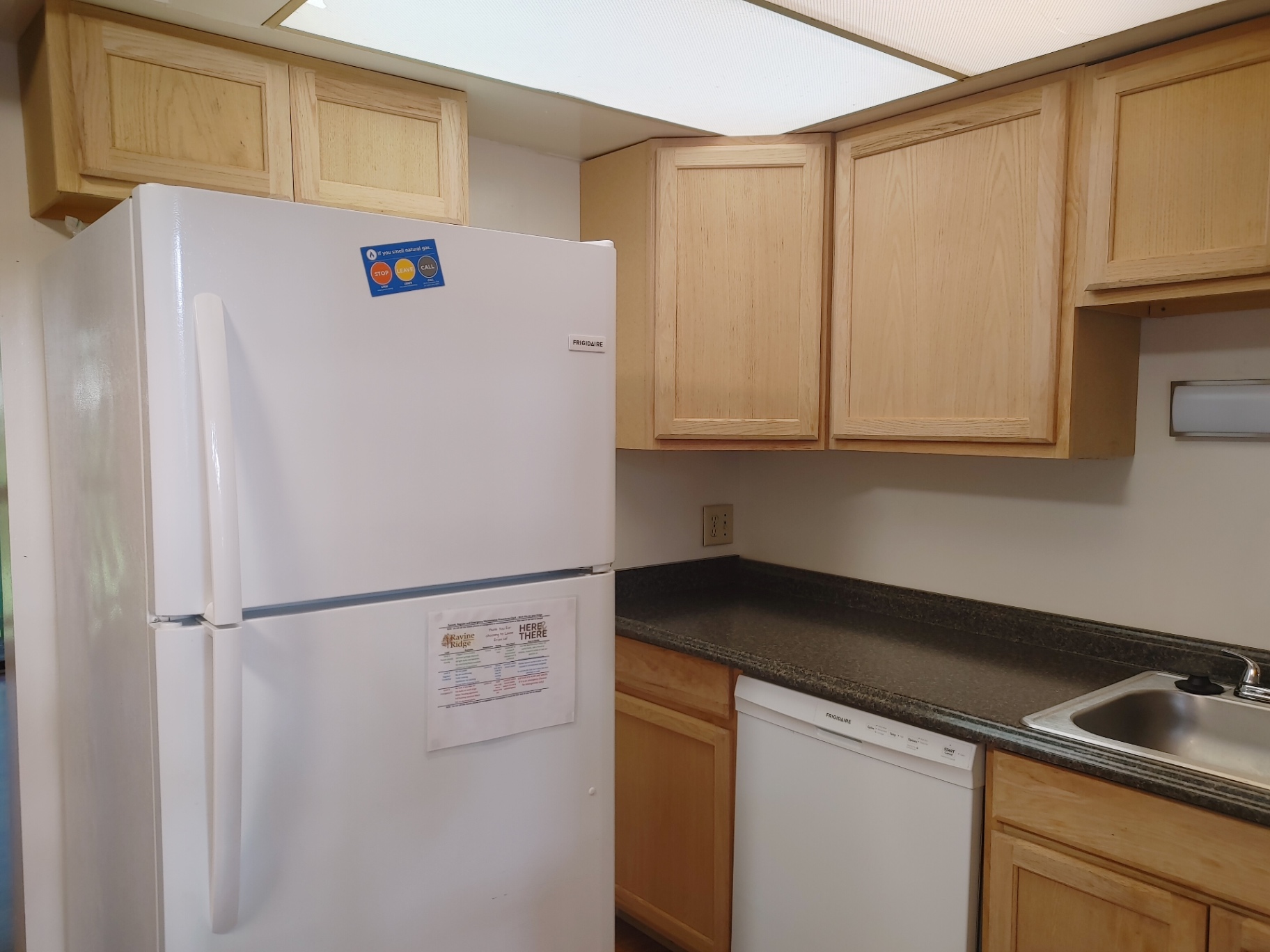 2016 Iuka Ave. kitchen with full-size refrigerator, dishwasher, and long prep counter