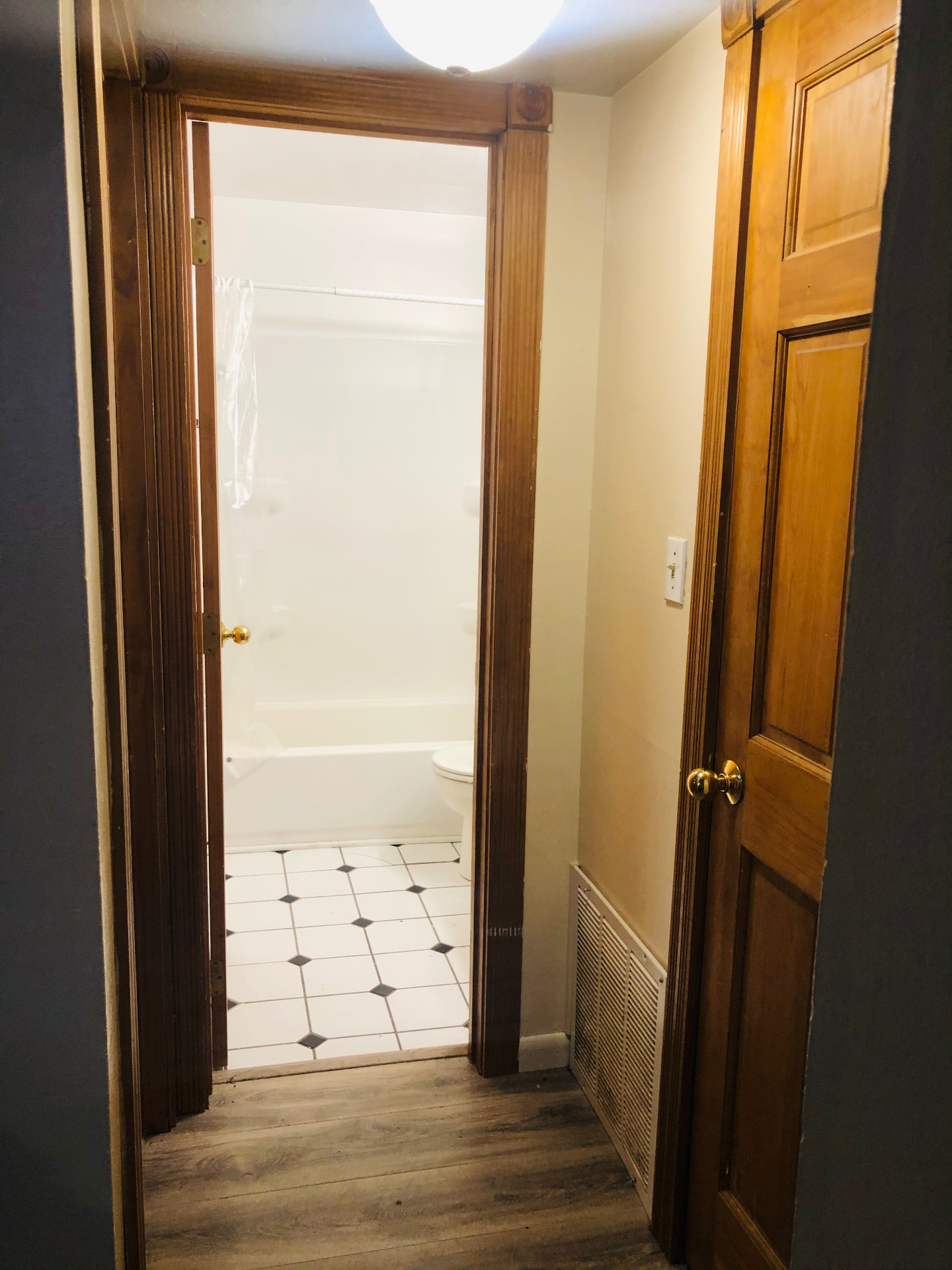 2150 N 4th St. Unit A bathroom entry with tile floor and wood trim