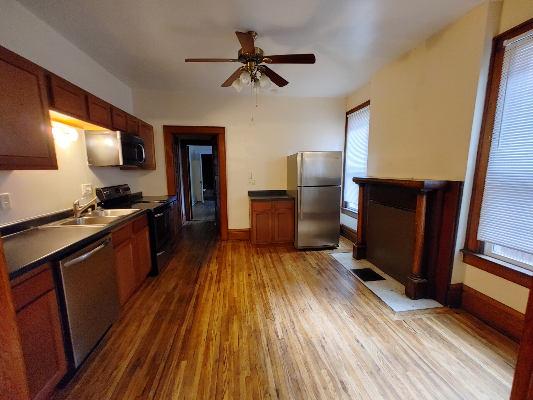 374 A E 14th Ave. kitchen with dark cabinets, stainless appliances, dishwasher, and hardwood floors