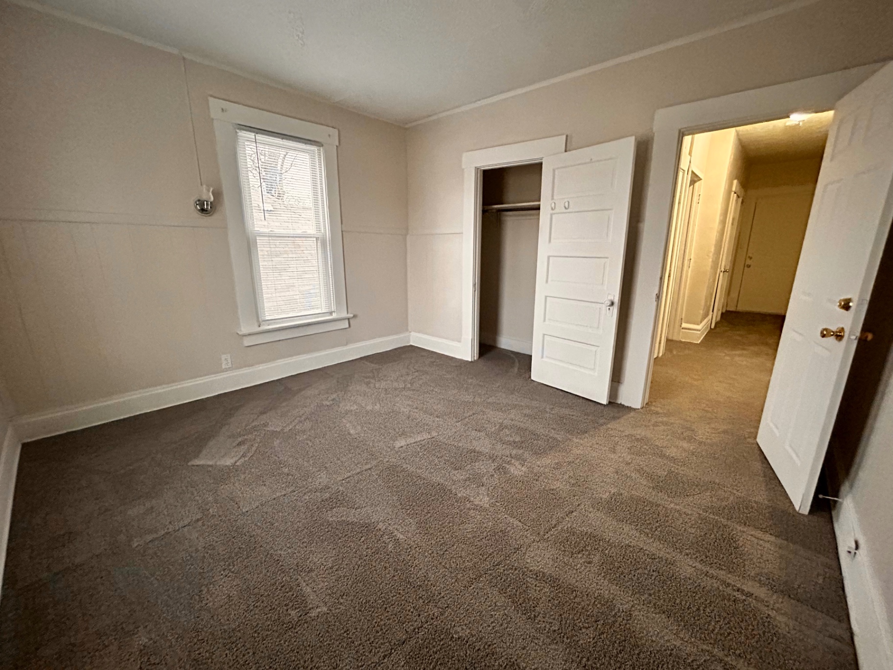68 E Patterson Ave. carpeted bedroom with closet and hallway view