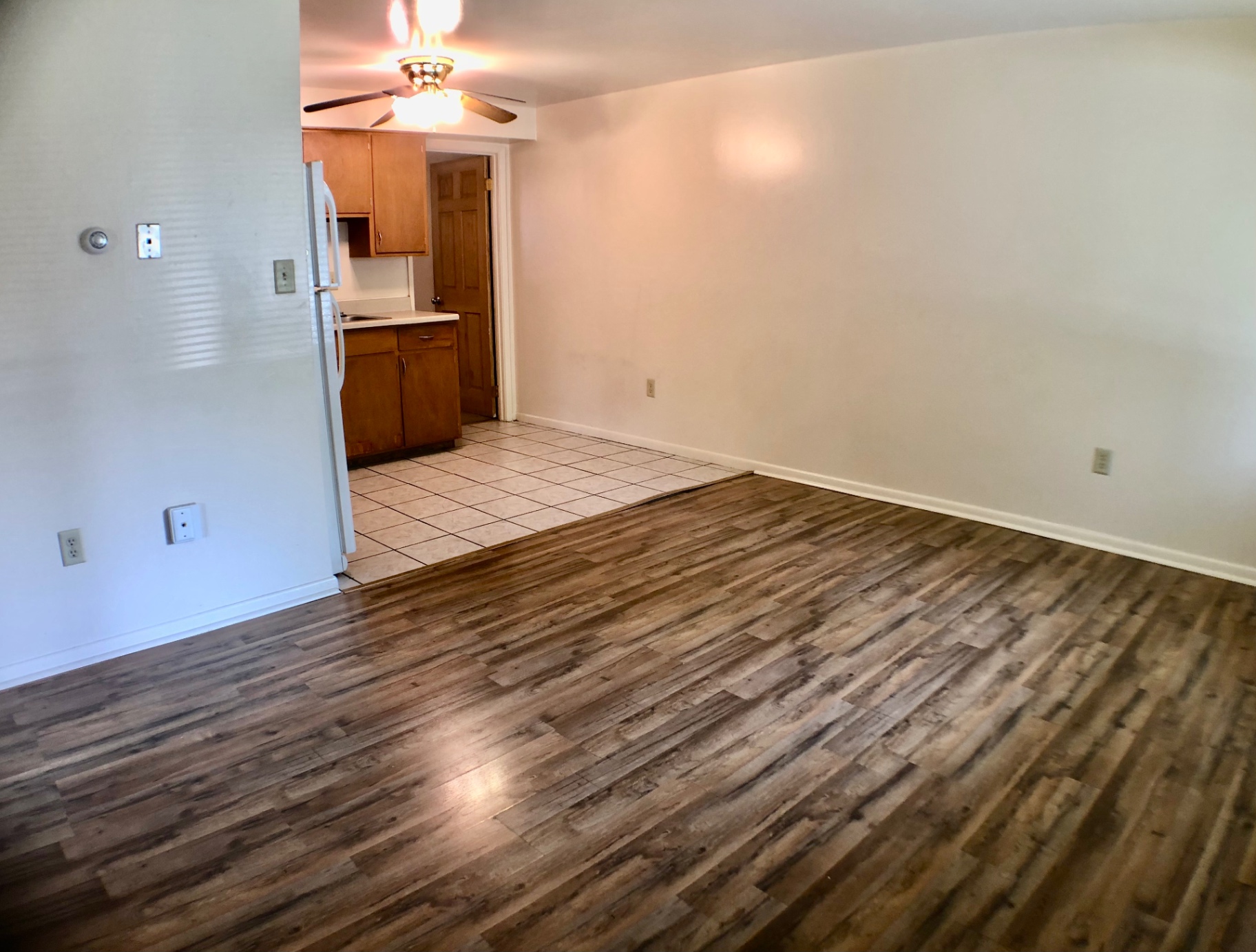 1827 N 4th St. Unit 1 living area opening to tile kitchen with ceiling fan