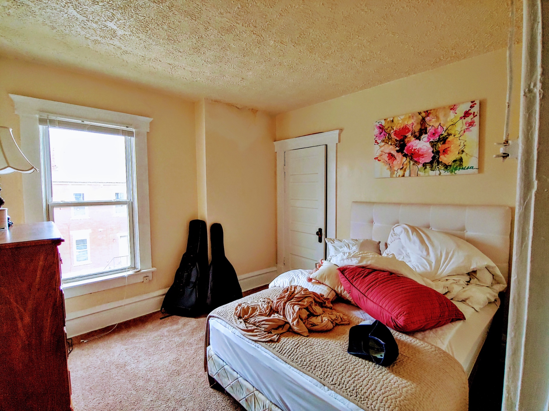 113 W 9th second bedroom with carpet and large window