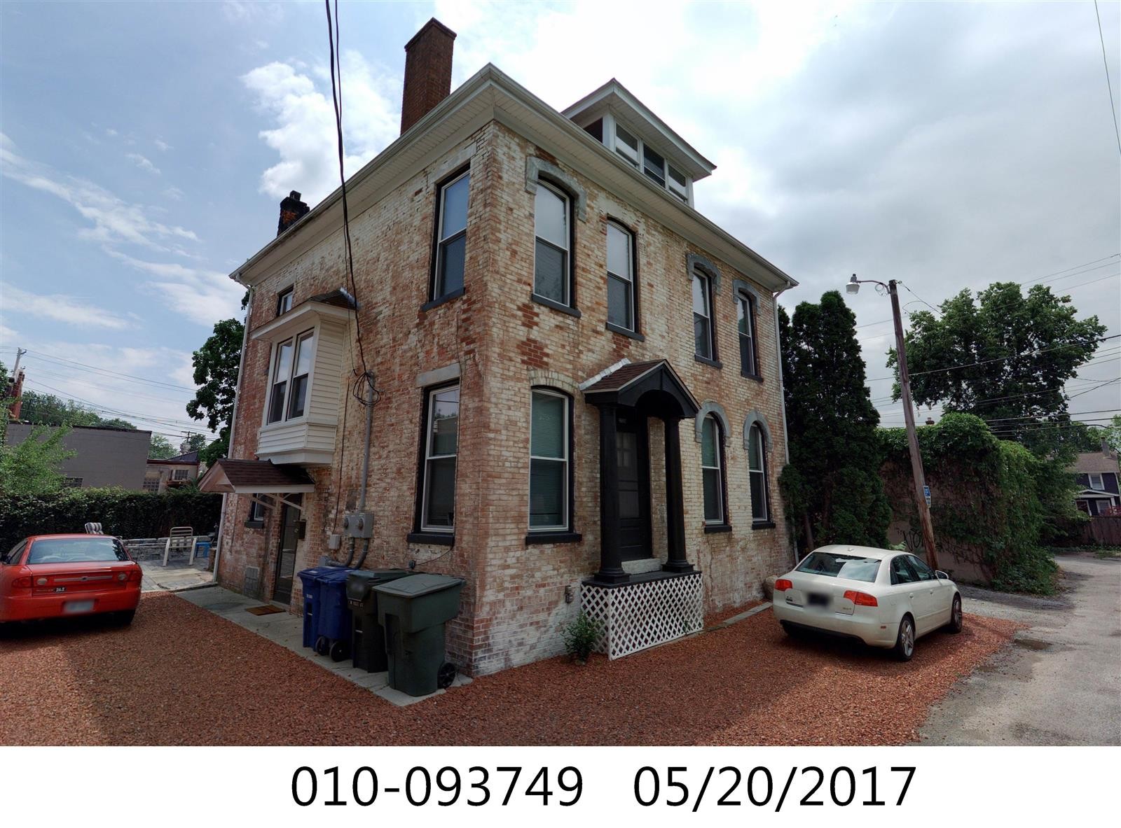 3338 Chestnut historic brick house exterior with covered entry and off-street parking