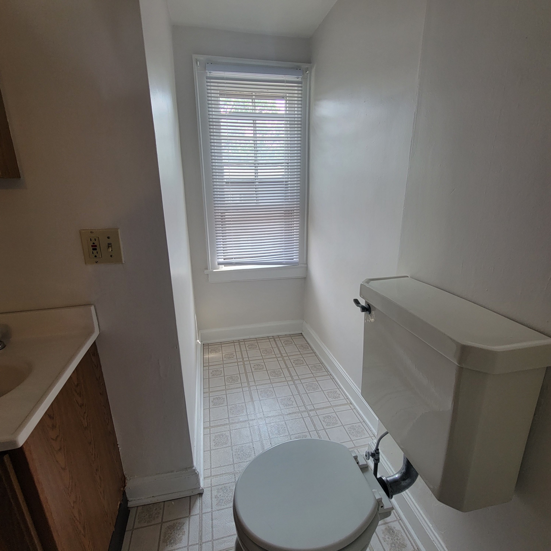 2048 Iuka Ave. C half bath showing toilet and bright window