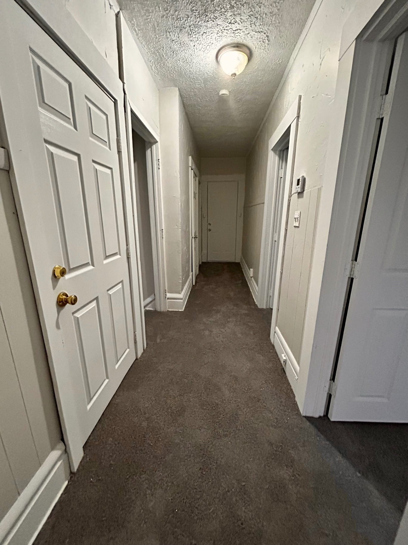 68 E Patterson Ave. upstairs hallway with multiple bedroom doors