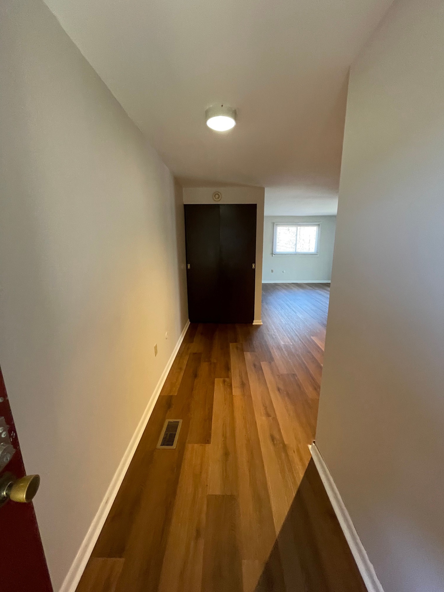 2020 Summit St. bedroom-level hallway with plank floors leading to the bedrooms