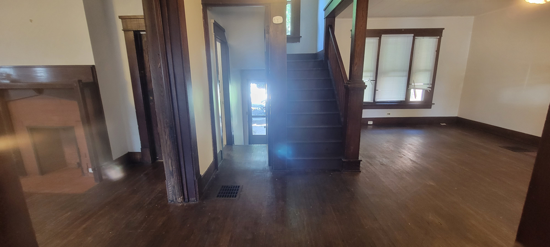 2015 Summit St. entry foyer with dark wood staircase and hardwood floors