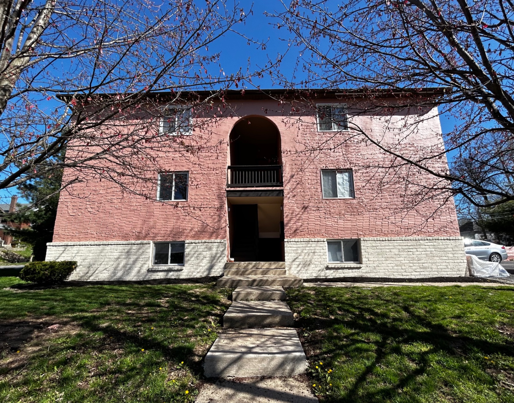 2150 N 4th St. Unit A front exterior of pink stucco building with arched entryway