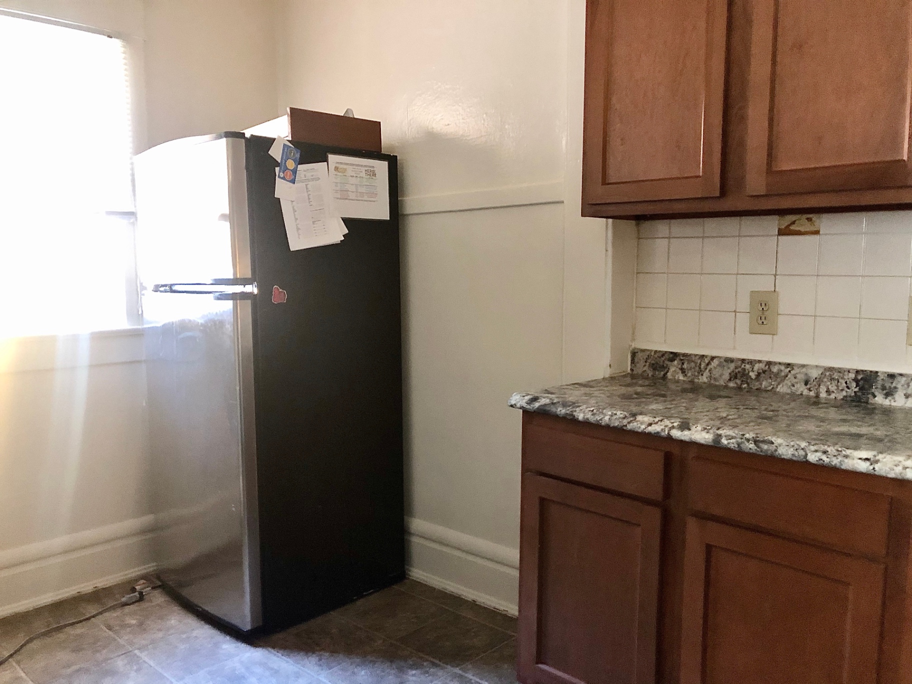 2015 Summit St. kitchen with granite countertops, maple cabinets, and stainless refrigerator