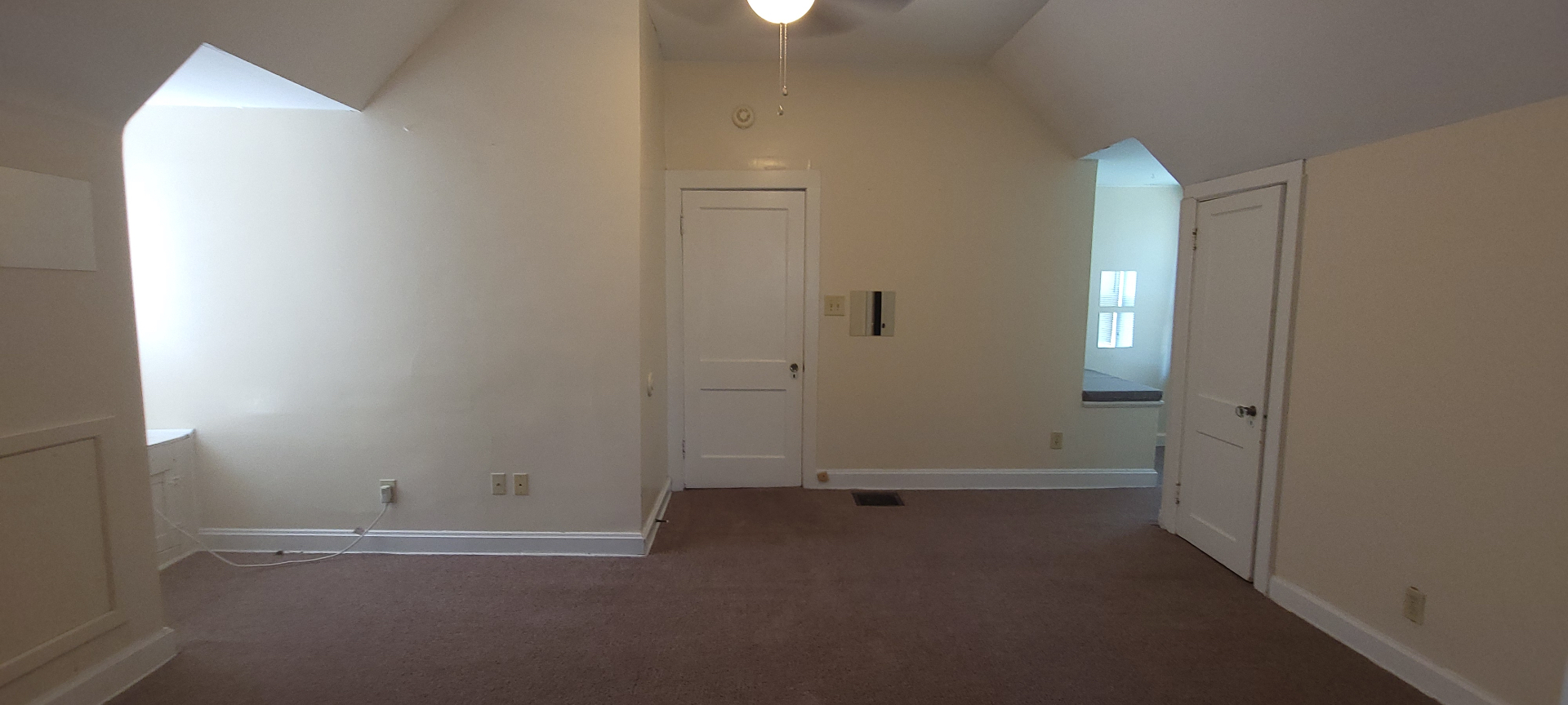 2054 Iuka Ave. C upstairs open landing with vaulted ceiling and dormer window