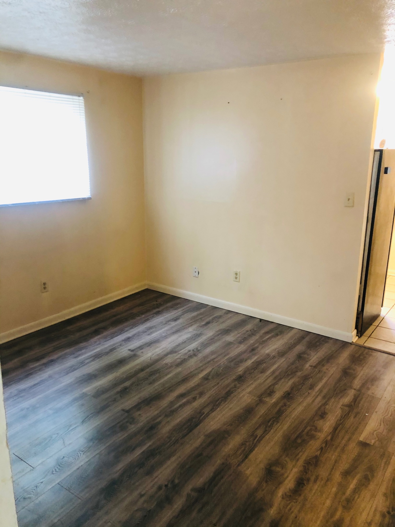 2150 N 4th St. Unit A dining area with wood-look flooring open to kitchen