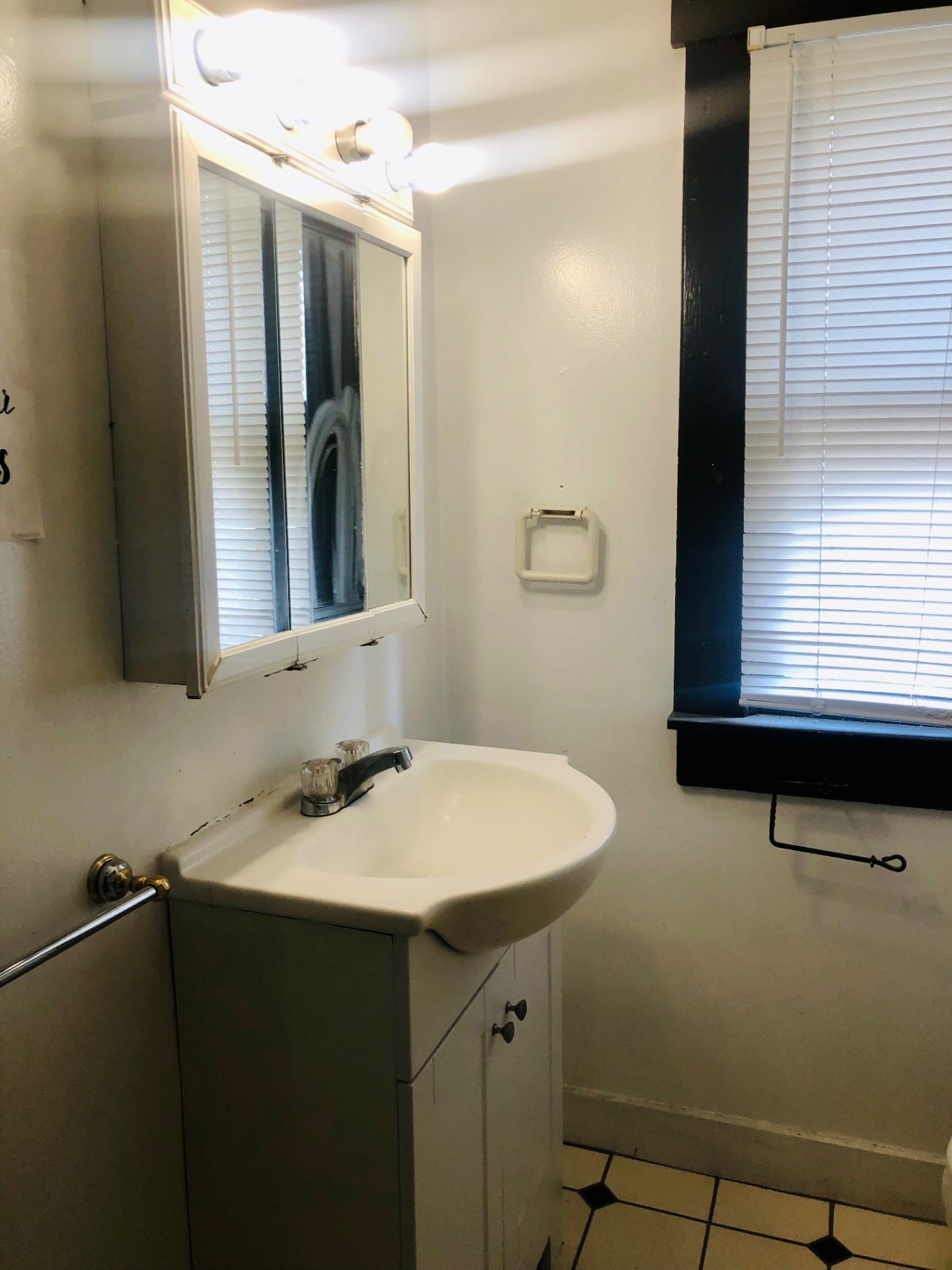 91½ E Woodruff Ave. bathroom vanity with medicine cabinet and window