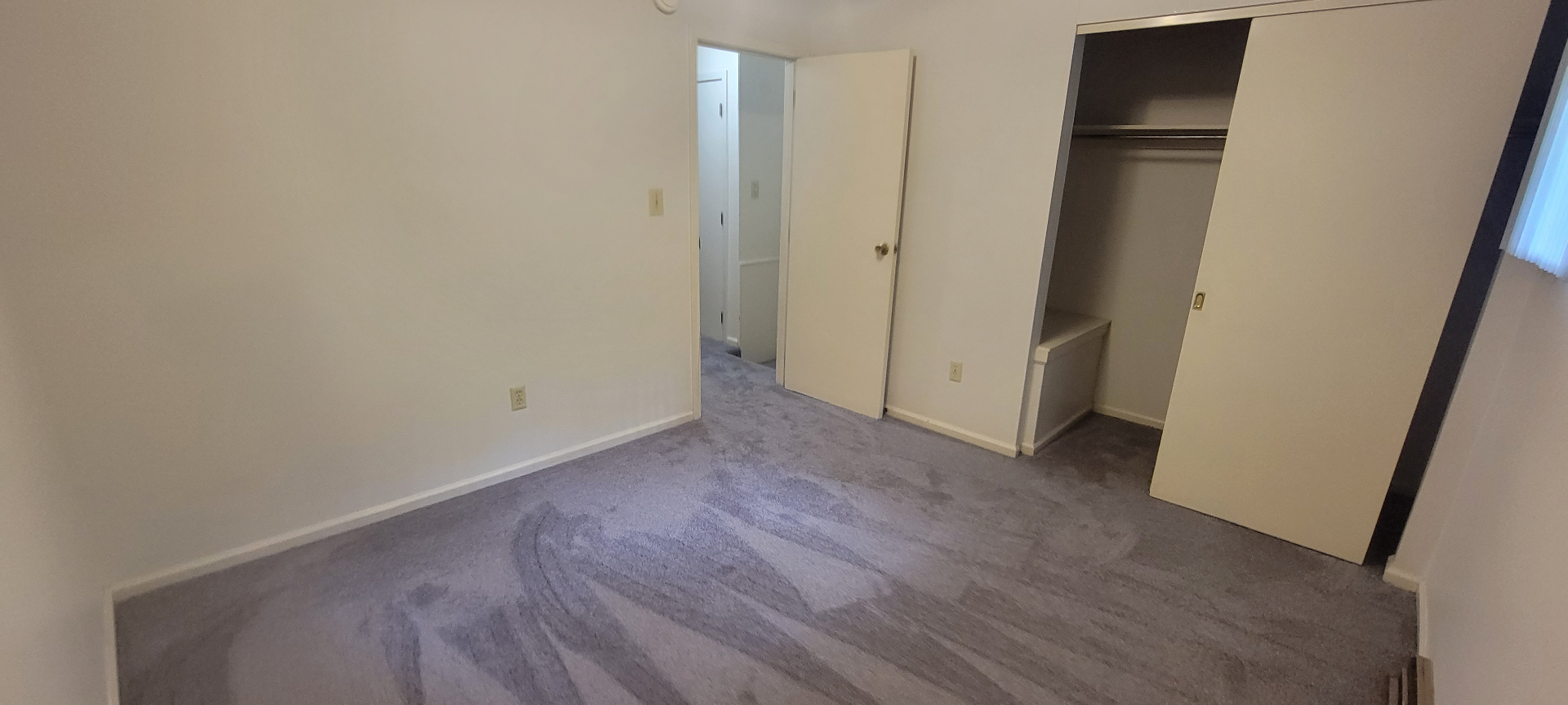 2022 Iuka Ave. bedroom with closet and view down the upper hallway