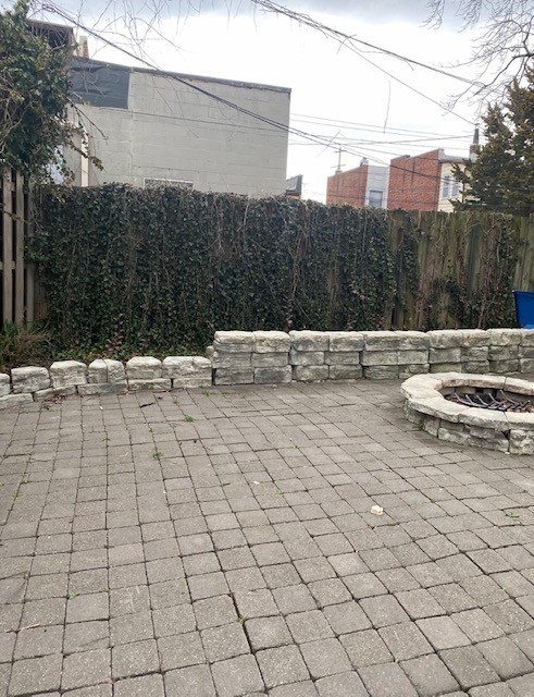 3340 Chestnut shared paver patio with stone fire pit and privacy fence