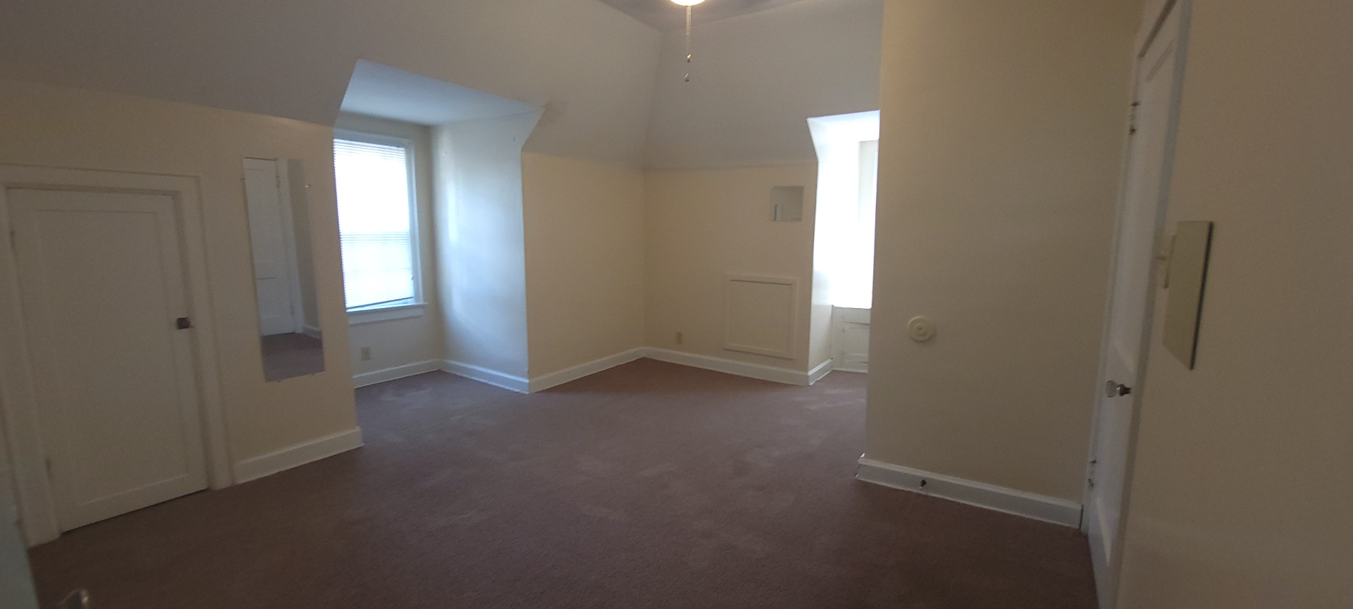 2054 Iuka Ave. C additional upstairs bedroom angle showing vaulted ceilings and generous open floor area