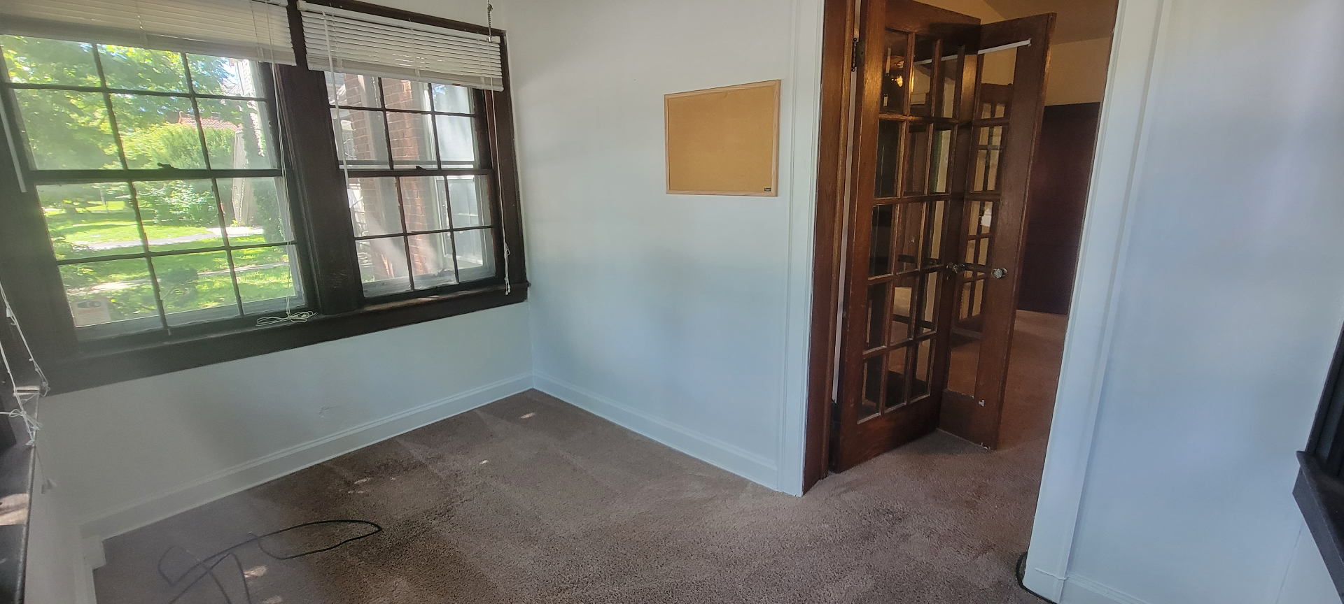 2054 Iuka Ave. A bonus room with double windows, French doors, and cork board