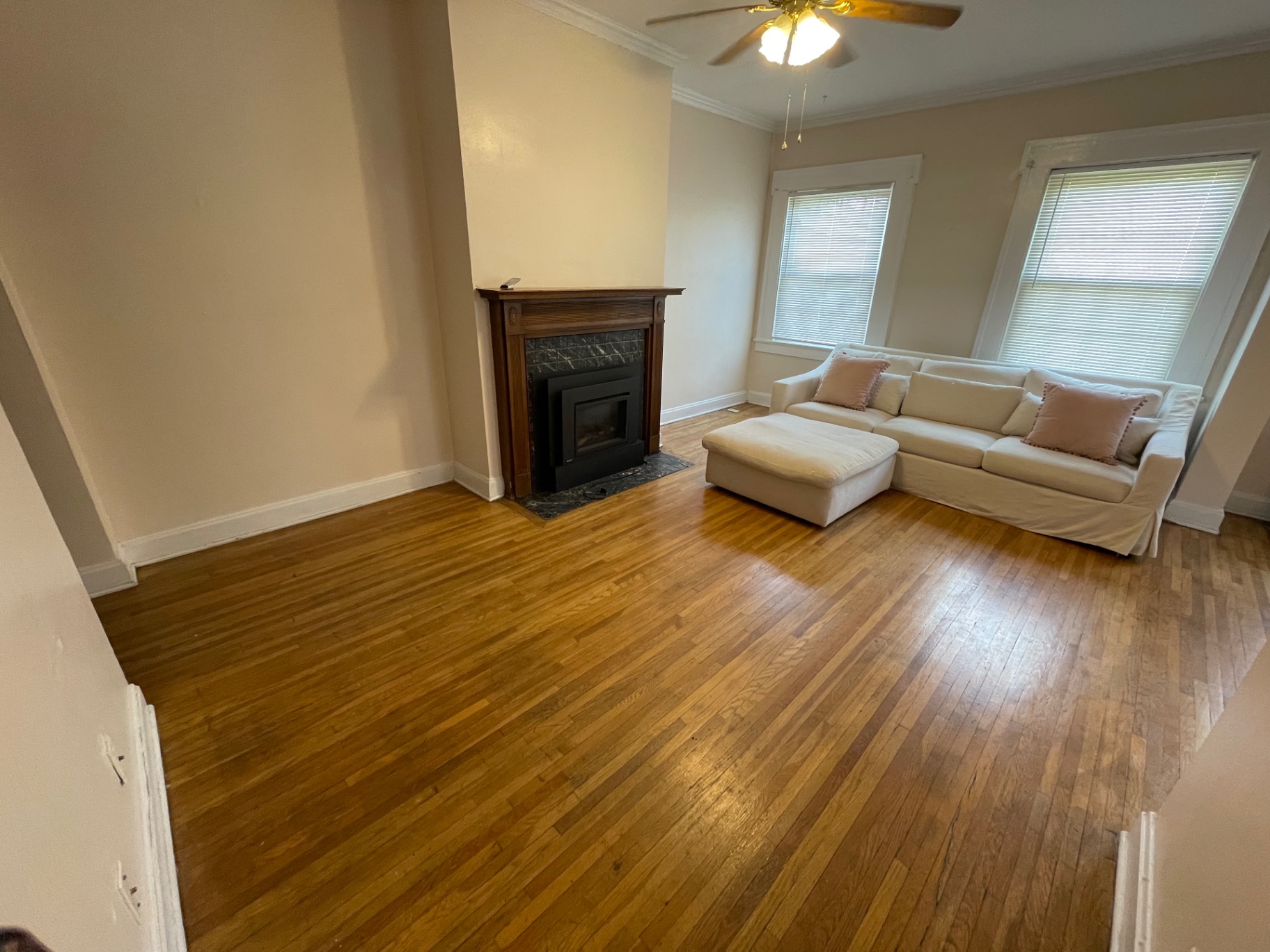 Unit E living area with fireplace and abundant natural light