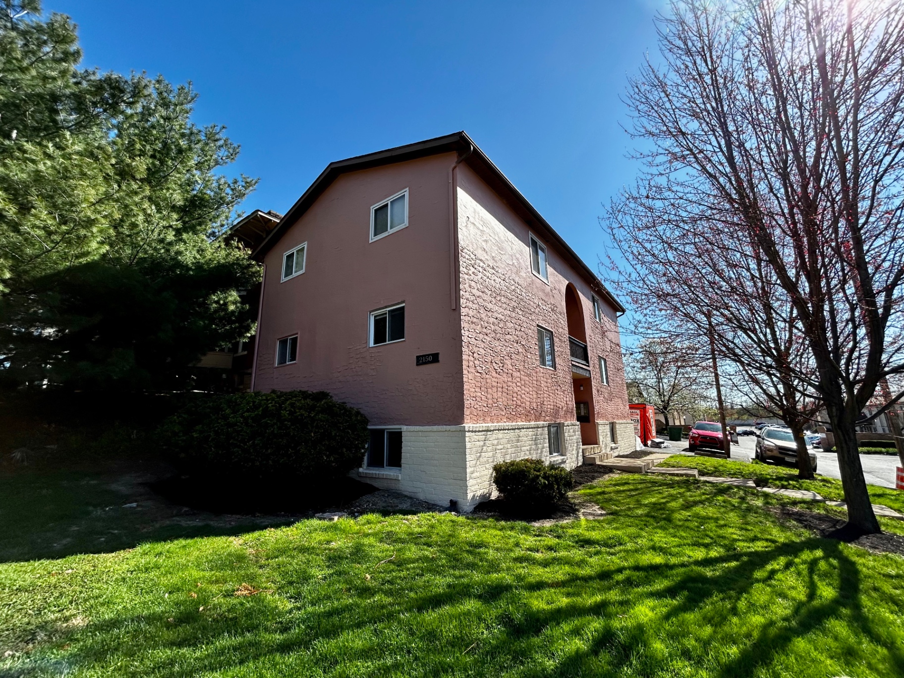 2150 N 4th St. Unit D side view of the three-story building with landscaping