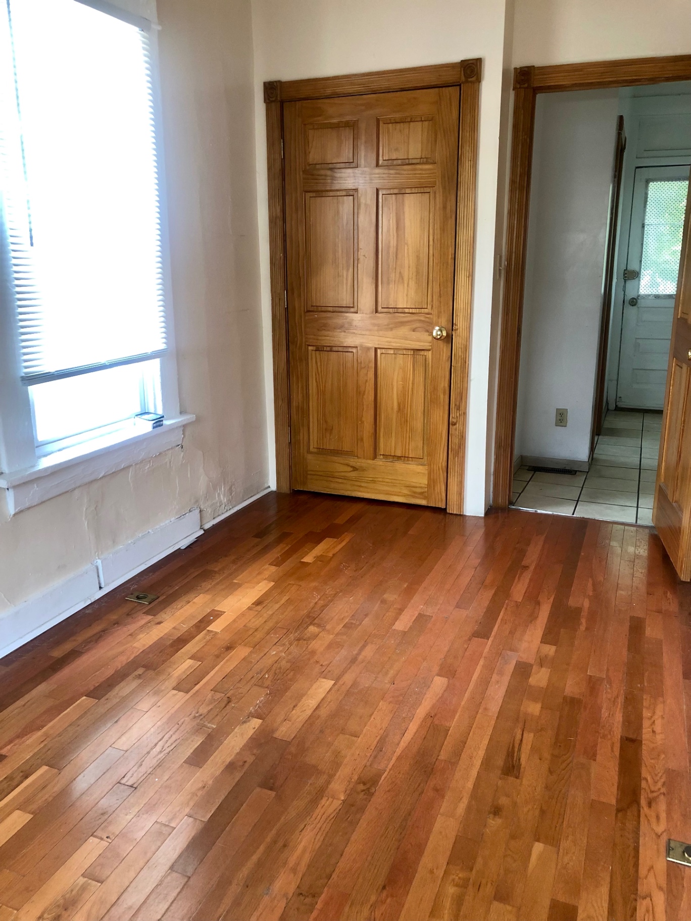 77 E Patterson Ave. hardwood-floor bedroom with paneled door and view to tiled kitchen