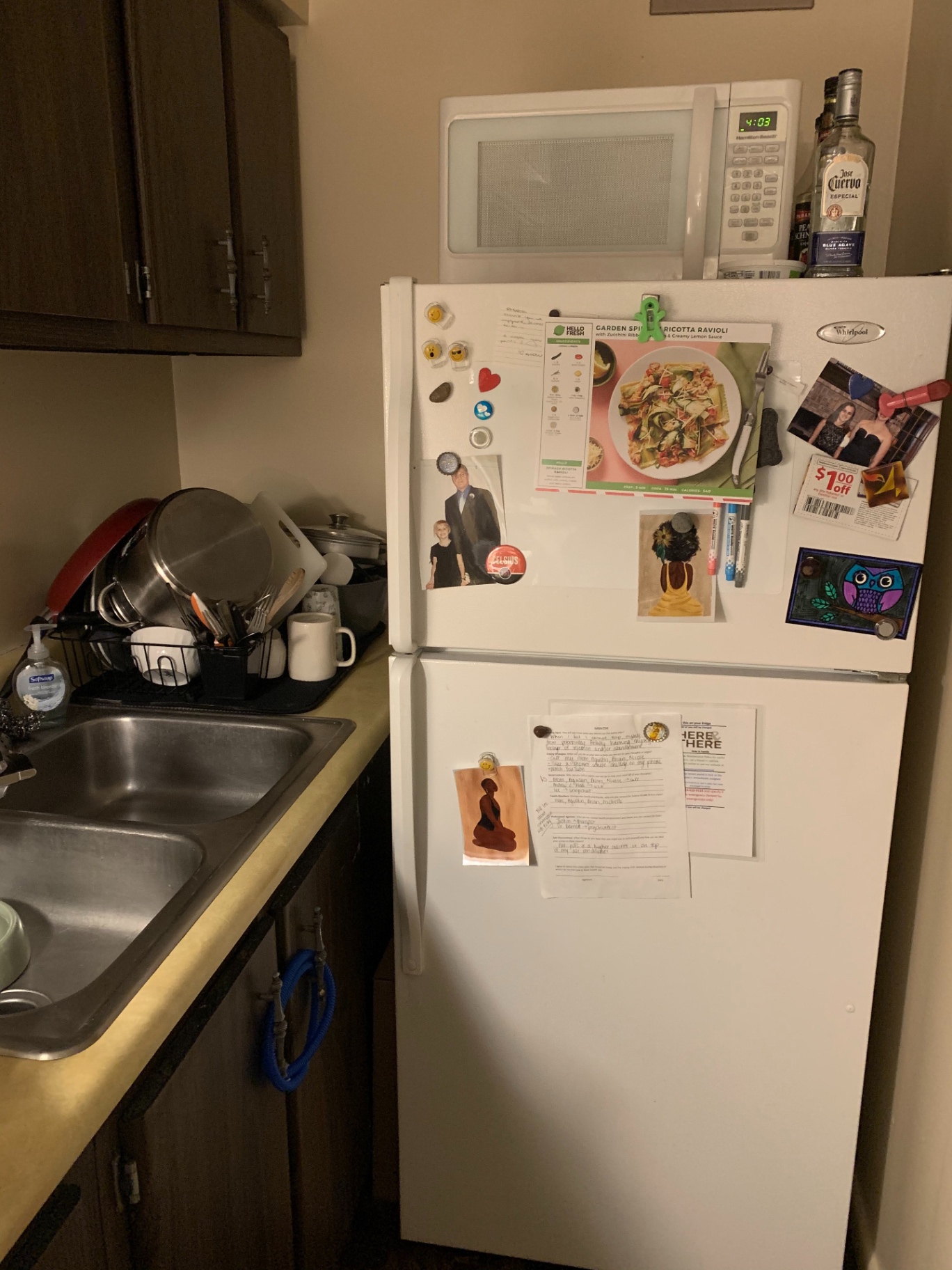2030 Summit St Unit 1 kitchen with refrigerator, microwave, and double sink