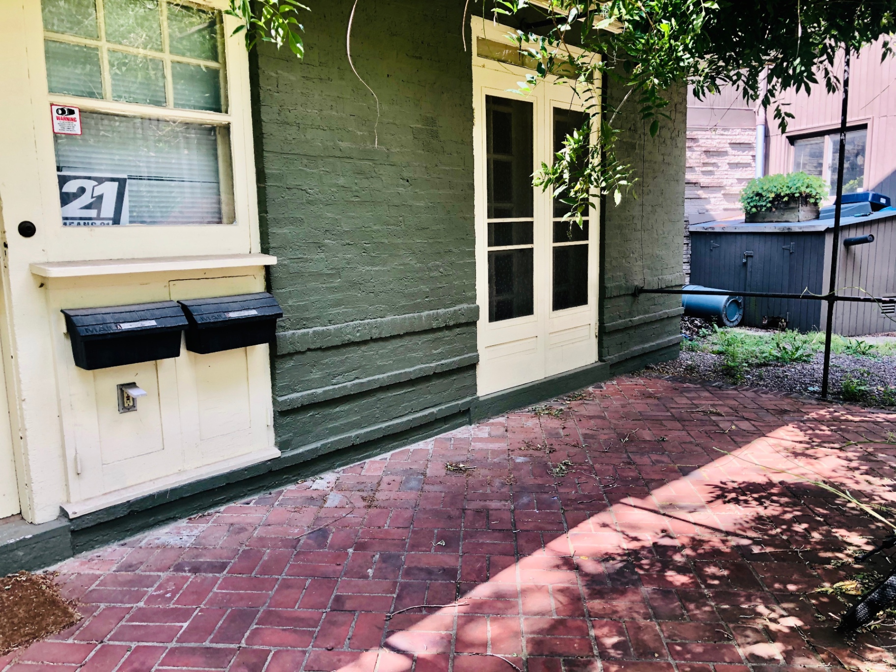 2034 Iuka Ave A private front entry with brick patio and French doors