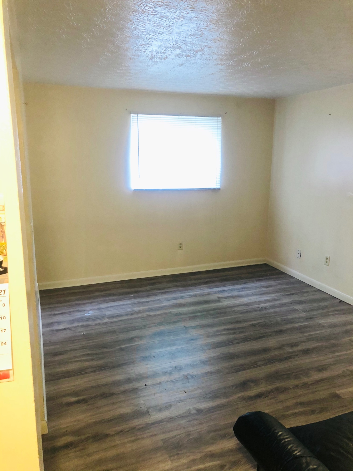 2150 N 4th St. Unit A living room with plank flooring and bright window