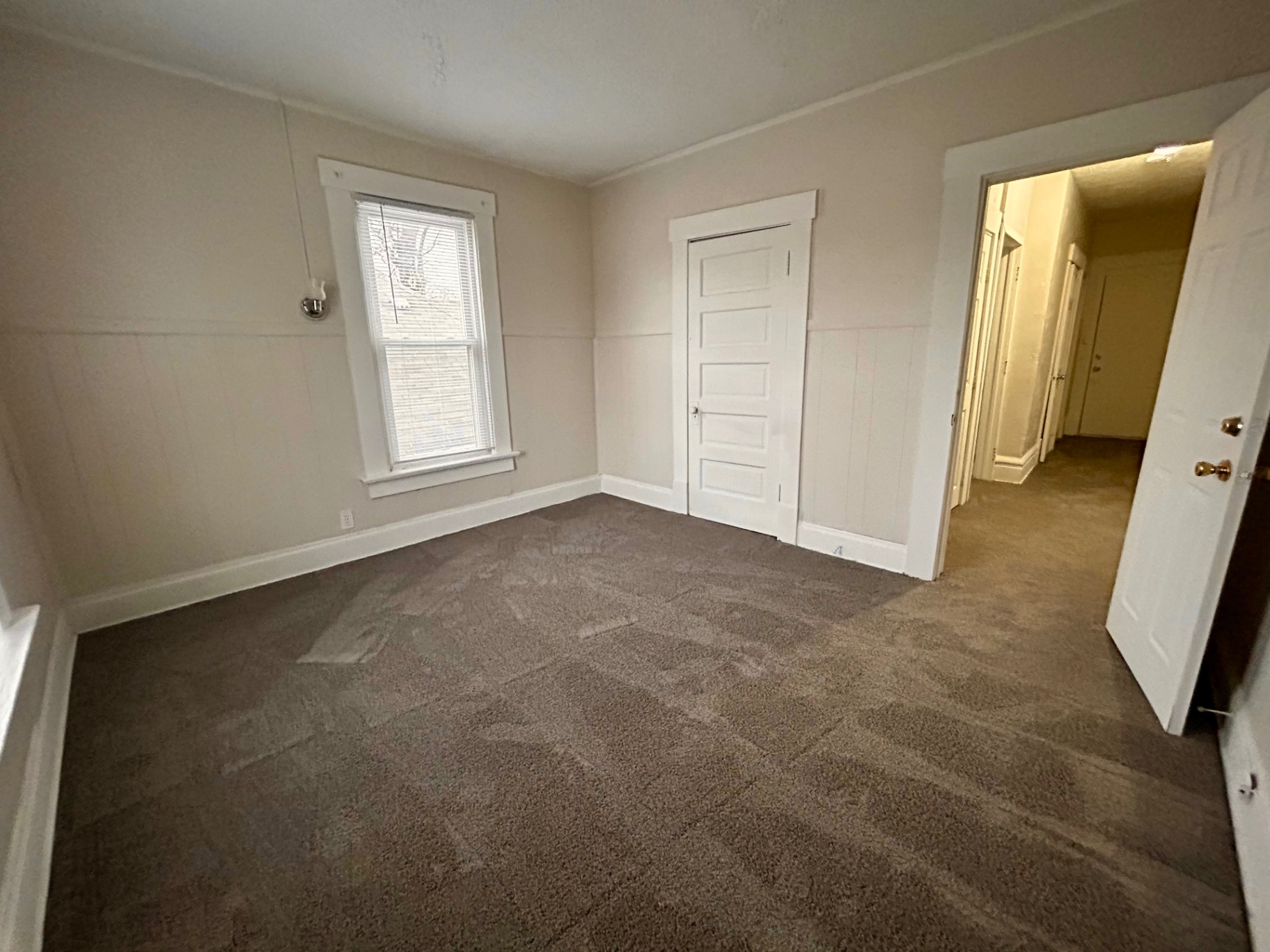 68 E Patterson Ave. carpeted bedroom with closet door and hallway view