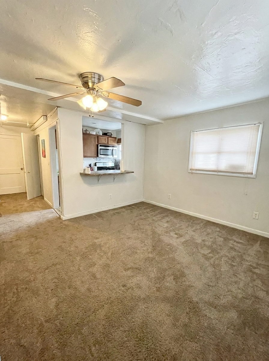 Unit M living area with luxury plank flooring and natural light